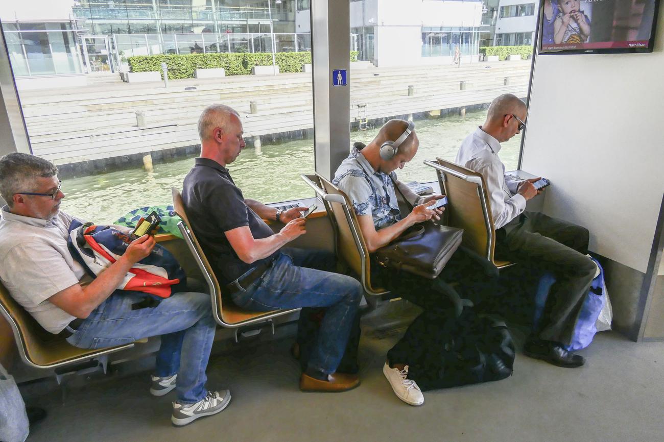 crowd on smartphone in public transport