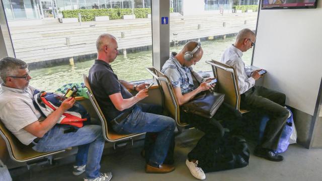 crowd on smartphone in public transport